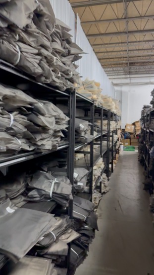 Wrapped apparel inventory on the shelving in our warehouse